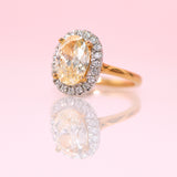 18ct gold yellow diamond ring with a diamond halo
