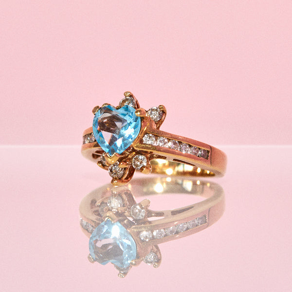 9ct gold ring set with a blue topaz and diamonds