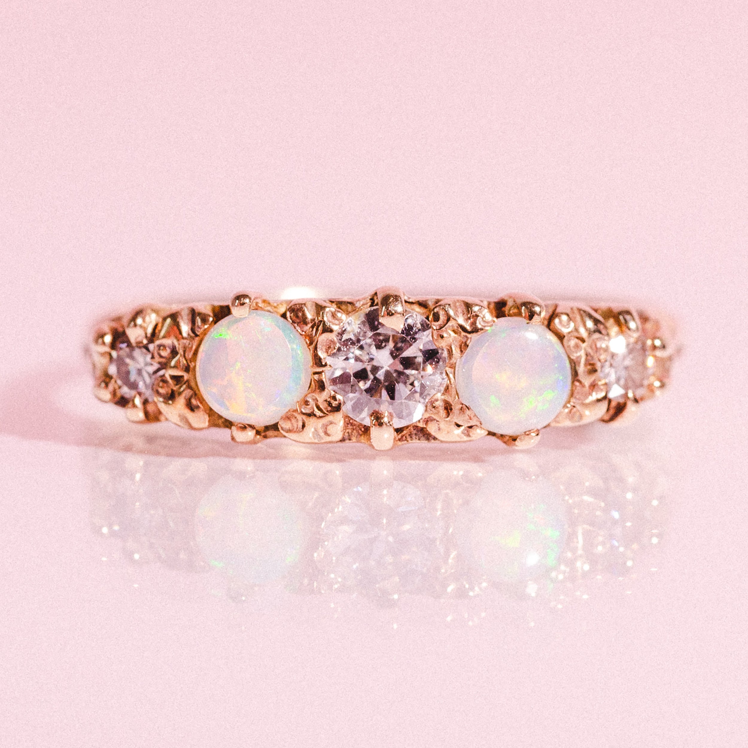 18ct gold ring set with opals and diamonds