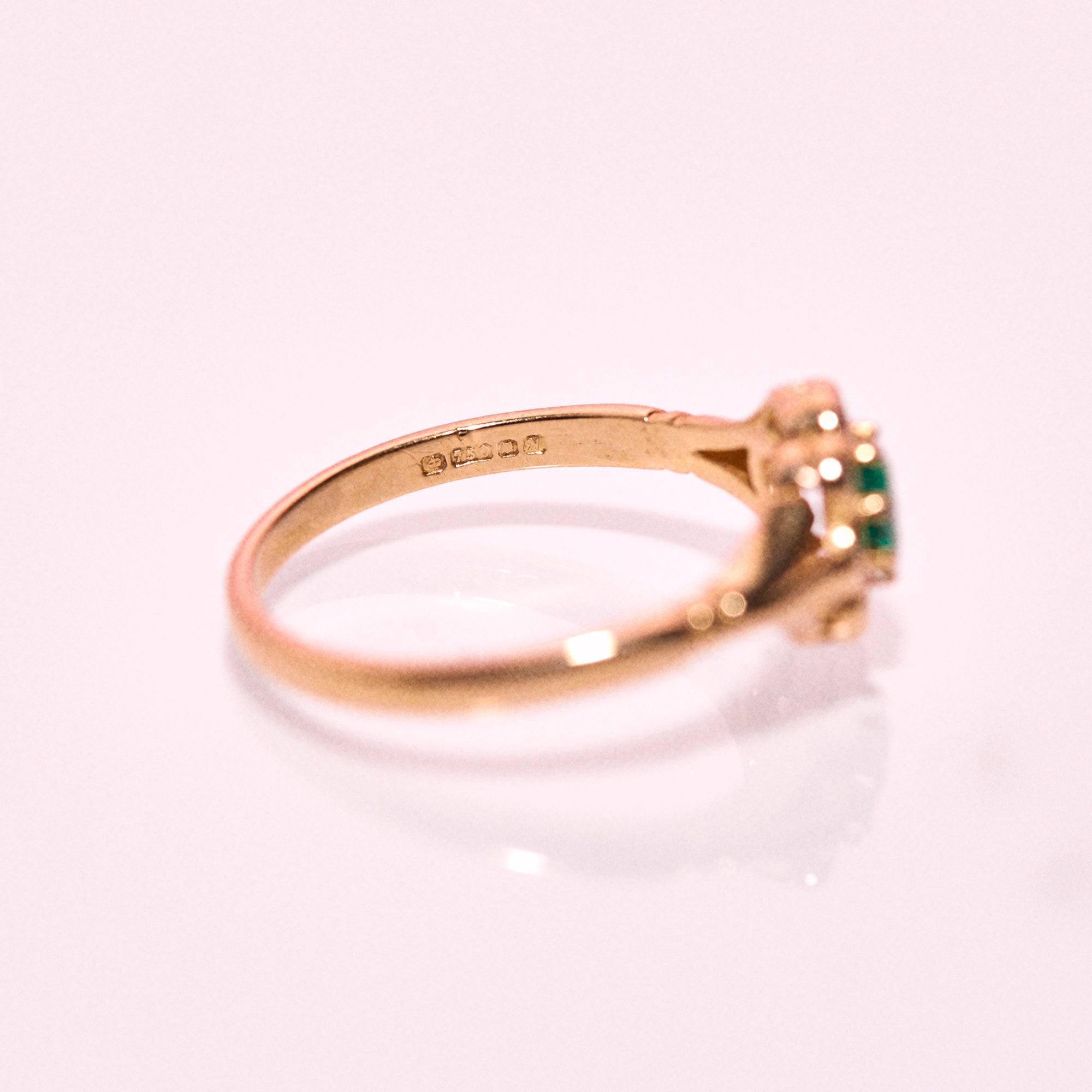 18ct gold ring set with an emerald and diamonds