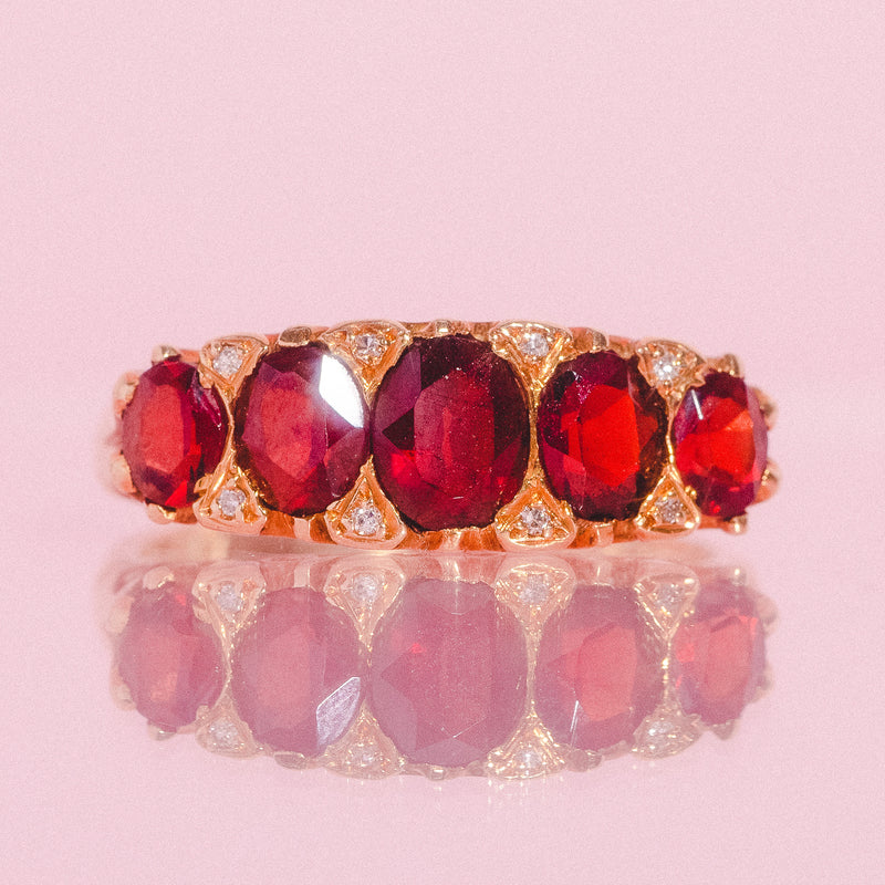 18ct gold carved ring with five garnets and diamonds