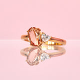 18ct gold ring set with a peach topaz and a heart shaped diamond