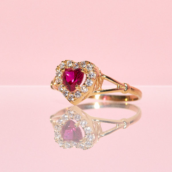 10ct gold ring set with a ruby and cubic zirconia