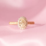 18ct gold ring set with a 1.01ct oval yellow diamond and a 0.38ct diamond halo