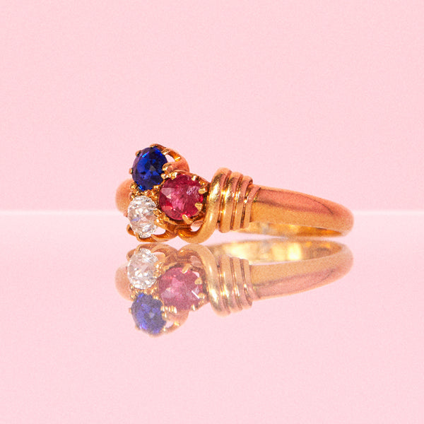 18ct gold ring set with a ruby, sapphire, diamond