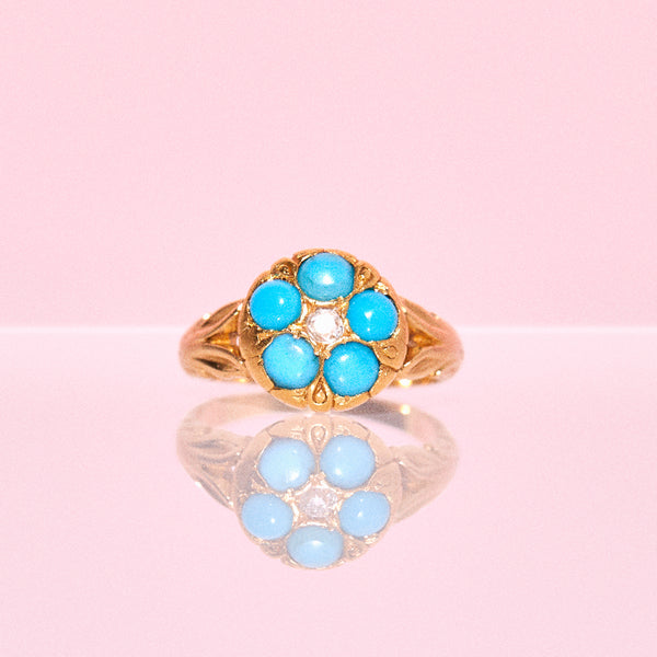 18ct gold ring set with turquoises and a diamond