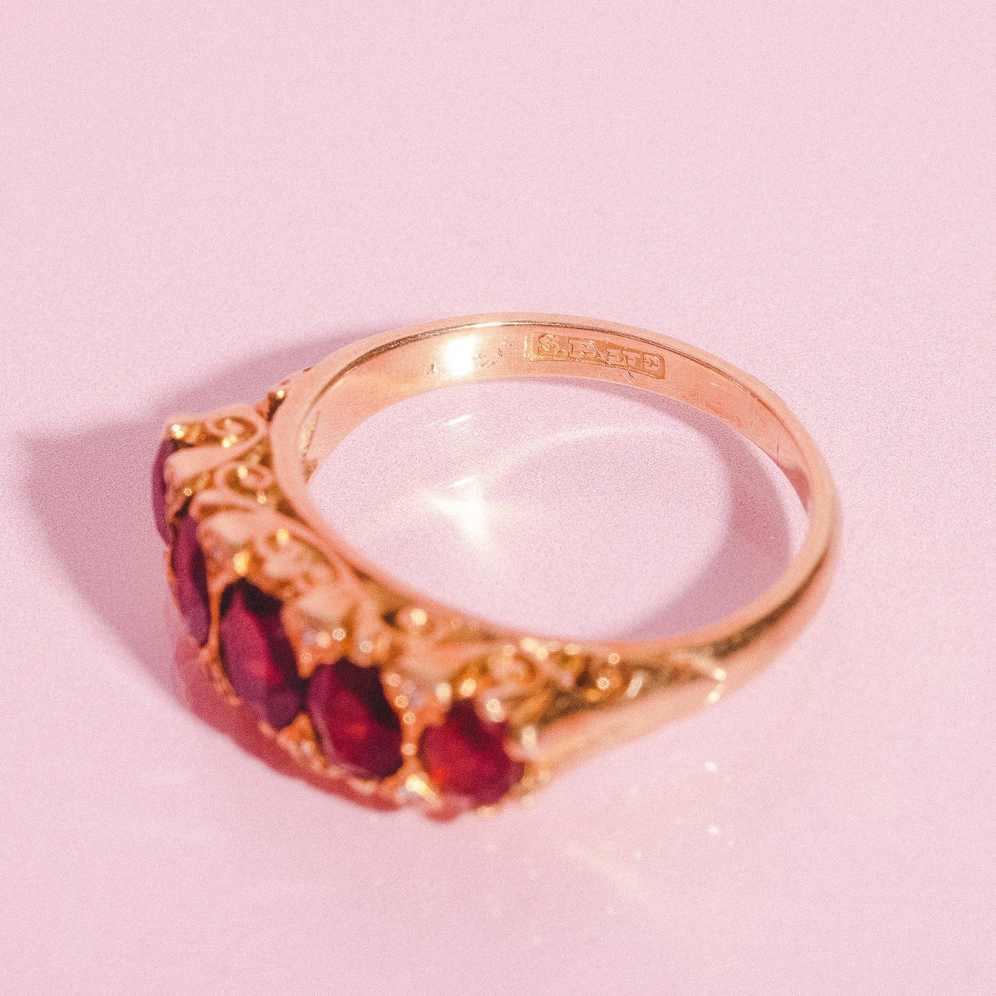 18ct gold carved ring with five garnets and diamonds