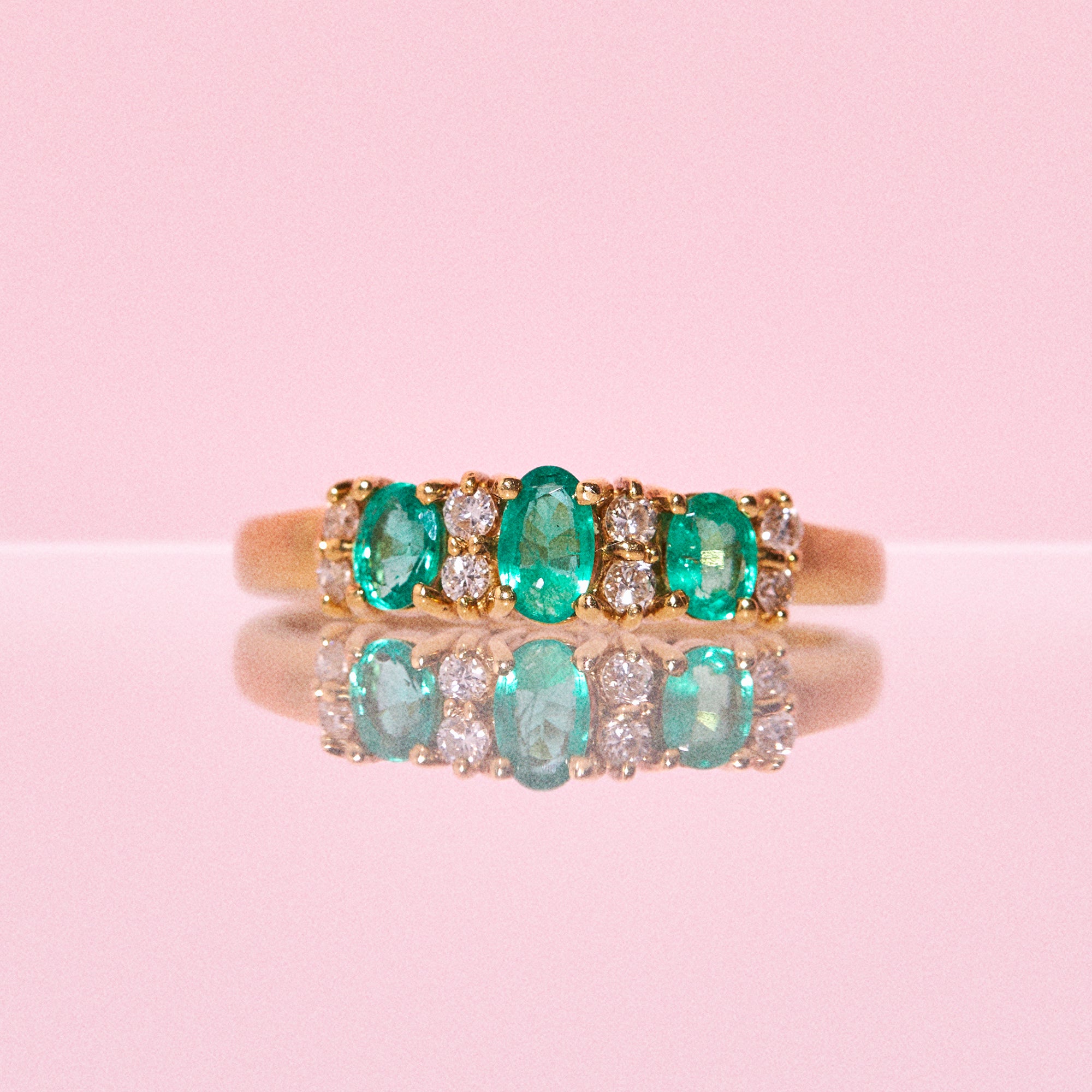 18ct gold ring set with emeralds and diamonds