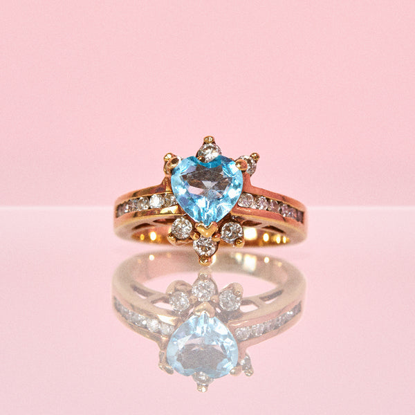 9ct gold ring set with a blue topaz and diamonds