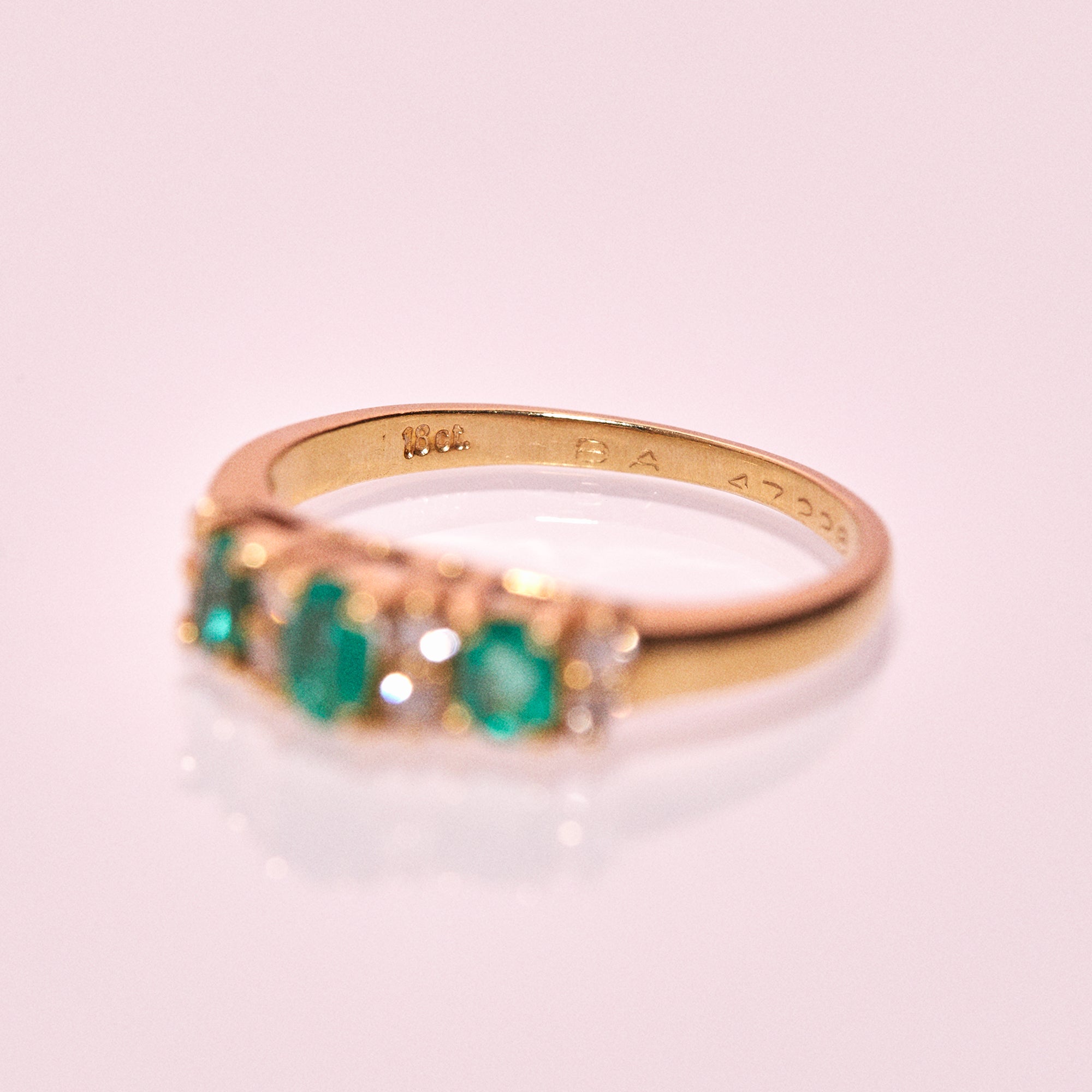 18ct gold ring set with emeralds and diamonds