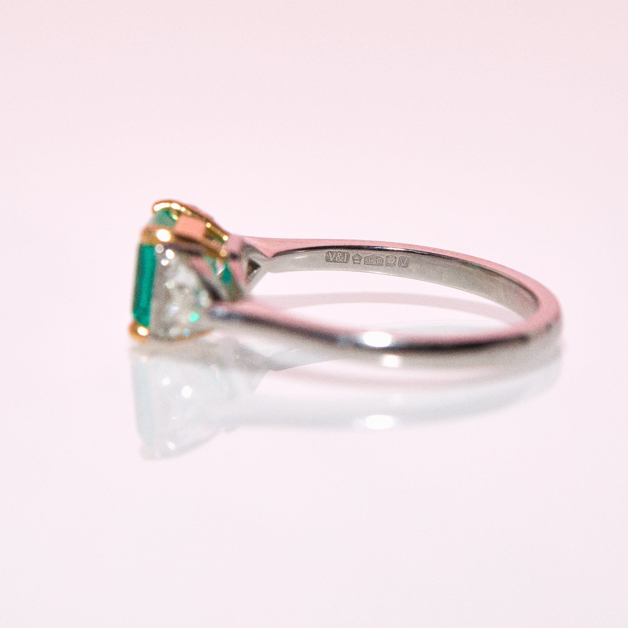 Platinum emerald and diamond three stone ring