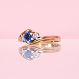 9ct gold three stone ring set with a sapphire and diamonds