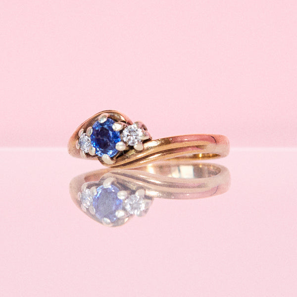 9ct gold three stone ring set with a sapphire and diamonds