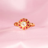 18ct gold ring set with rubies and a diamond